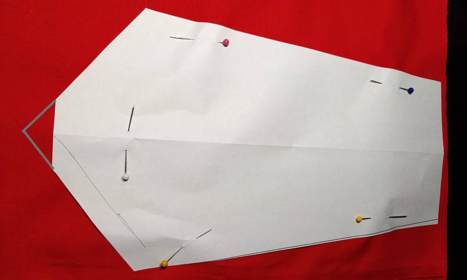 Cutting out the tie. My pattern piece was too short, so I drew the bottom section on the fabric