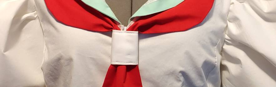 Tie-tie secured on the red tie