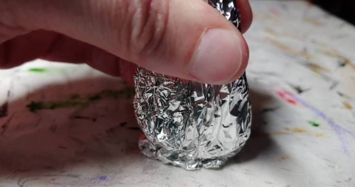 Flattening the end of the horn on the table