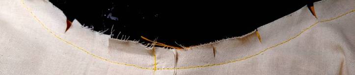 An inner curve clipped to let the fabric stretch around the curve