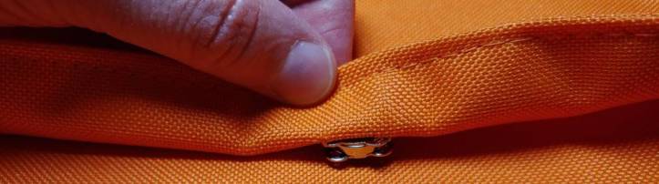 Pressing the lid against the body to mark where the magnetic snap should sit. The lip is pulled up to show the snap's position before marking.