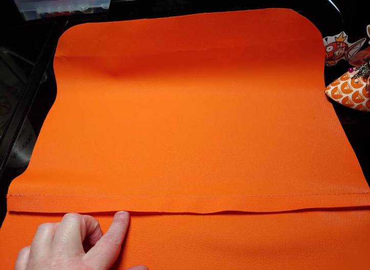 Two body pieces sewn together with the seam pressed down