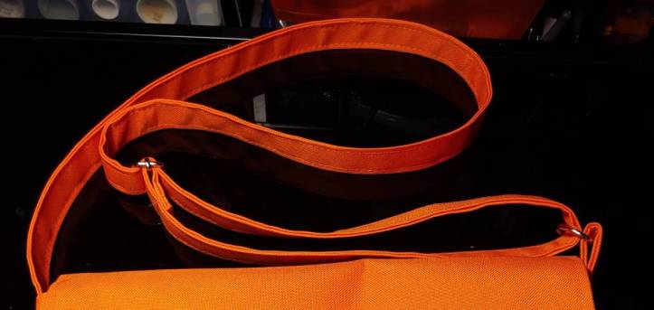 Finished strap, threaded and sewn