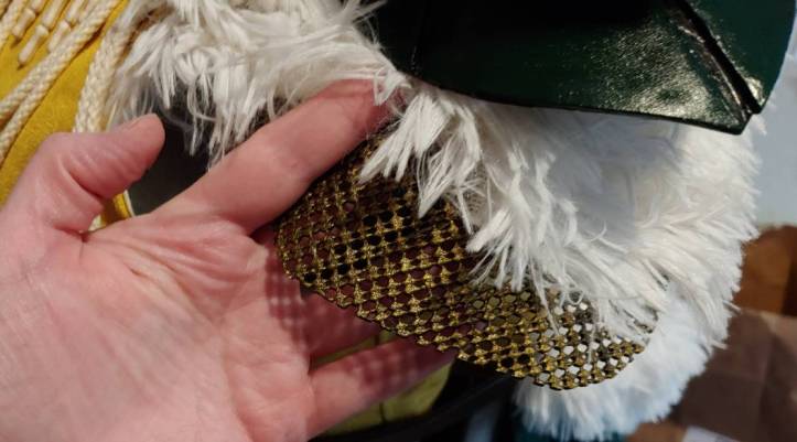 Maille tucked under fur and a shoulder pauldron on a sleeve