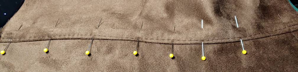 Seam pinned down and sewn with a straight stitch