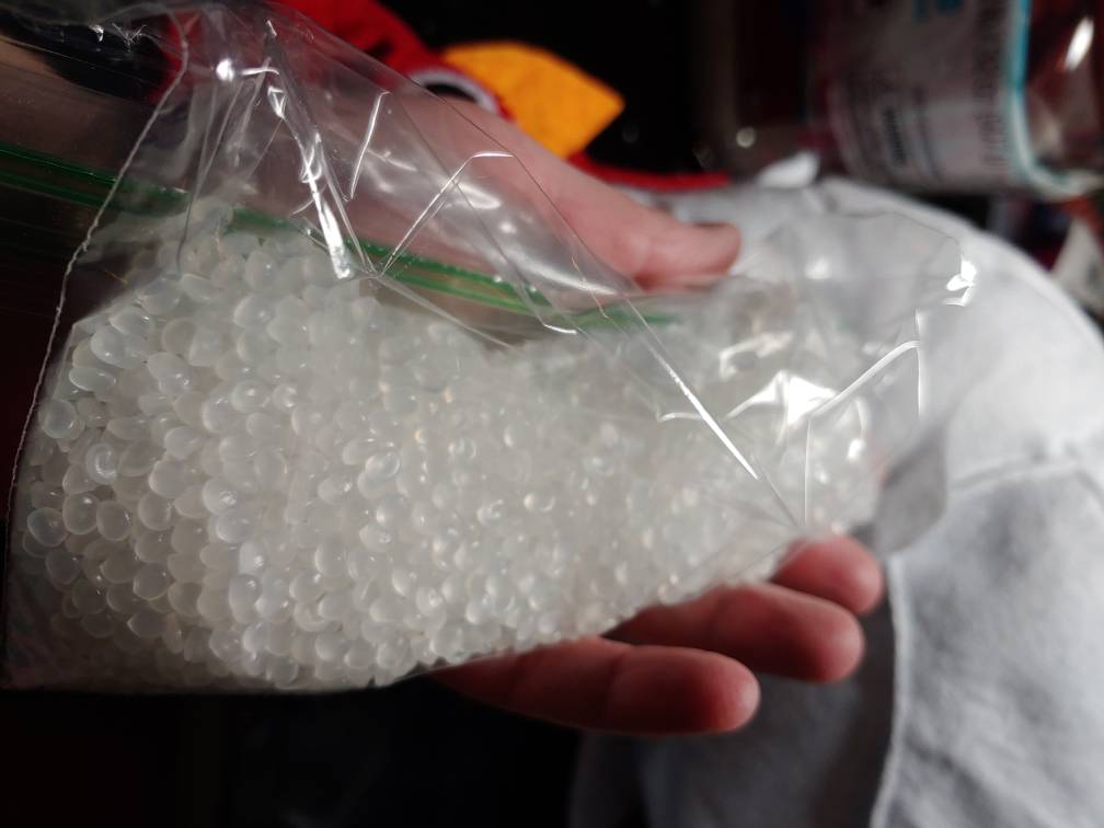 Sandwich baggie filled halfway with weighted beans for chicken