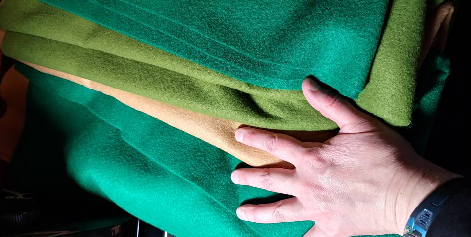 Various shades of green and beige acrylic felt used to make a turtle.