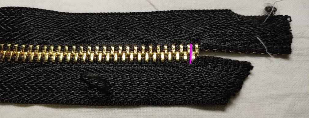 Sewn bottom stop, marked in magenta to make it easier to see