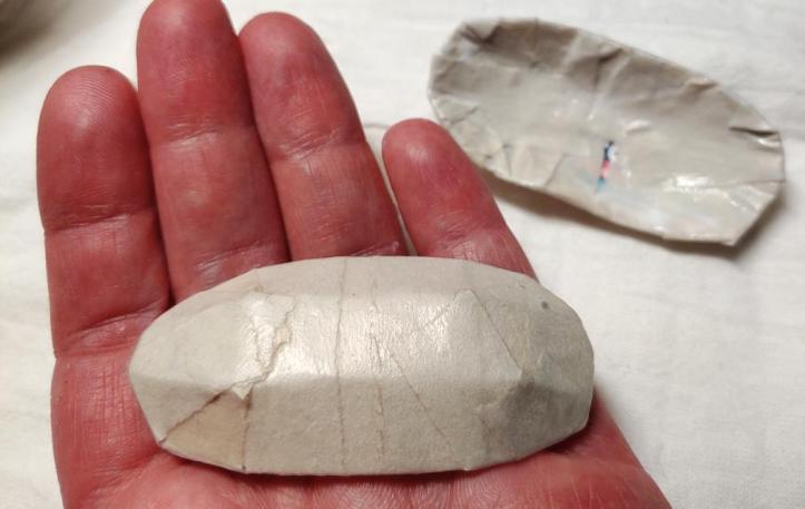 Finished paper mache on the clips. The clip in my hand is right-side up and the one in the background is upside-down.