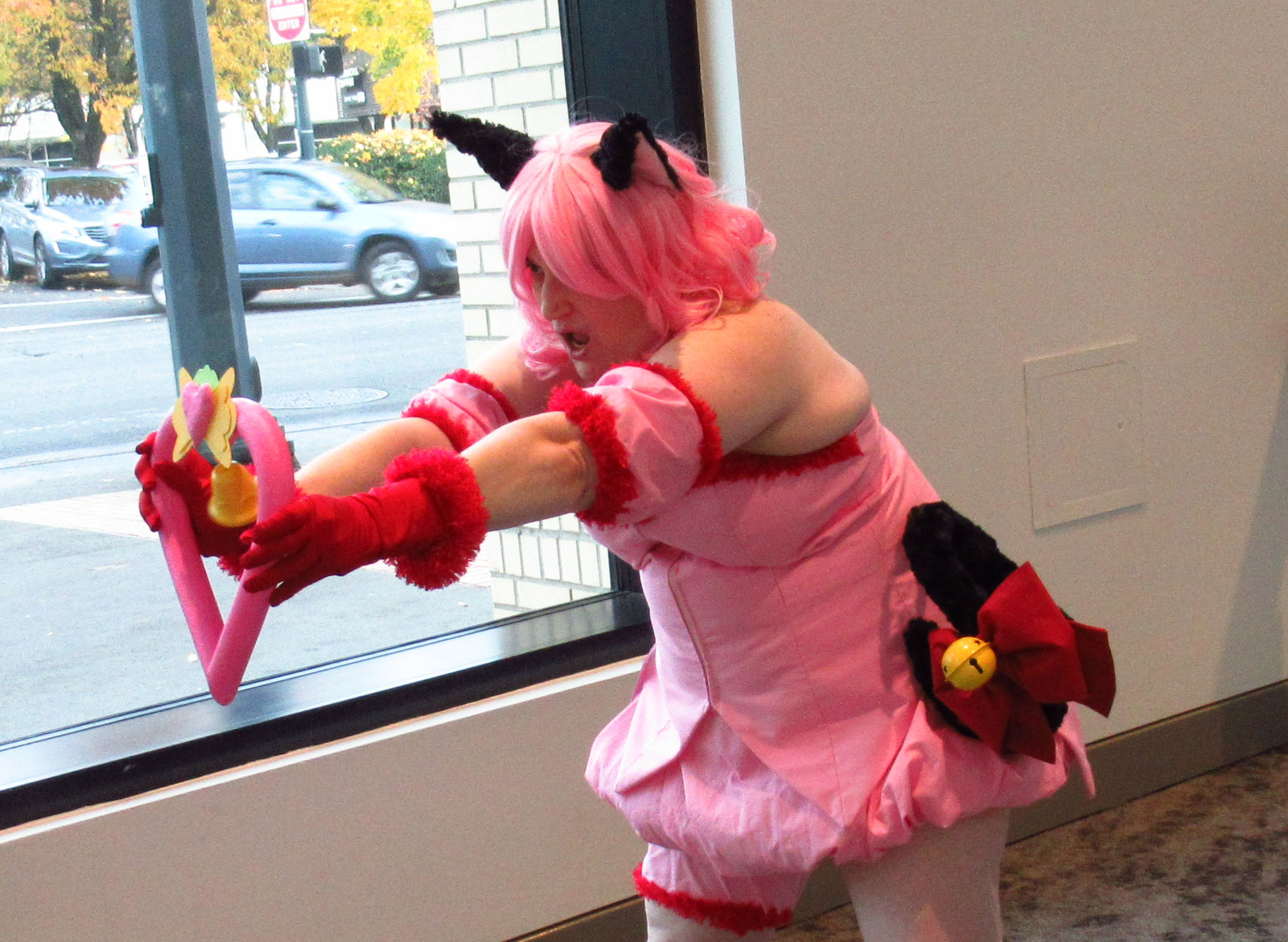 Ichigo leaning over to the left with bell extended