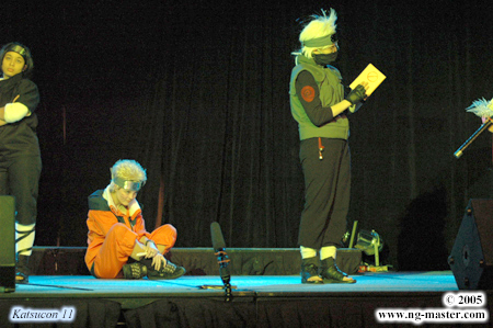 Kakashi with his team: Naruto sitting on the ground and Sasuke pretending not to care