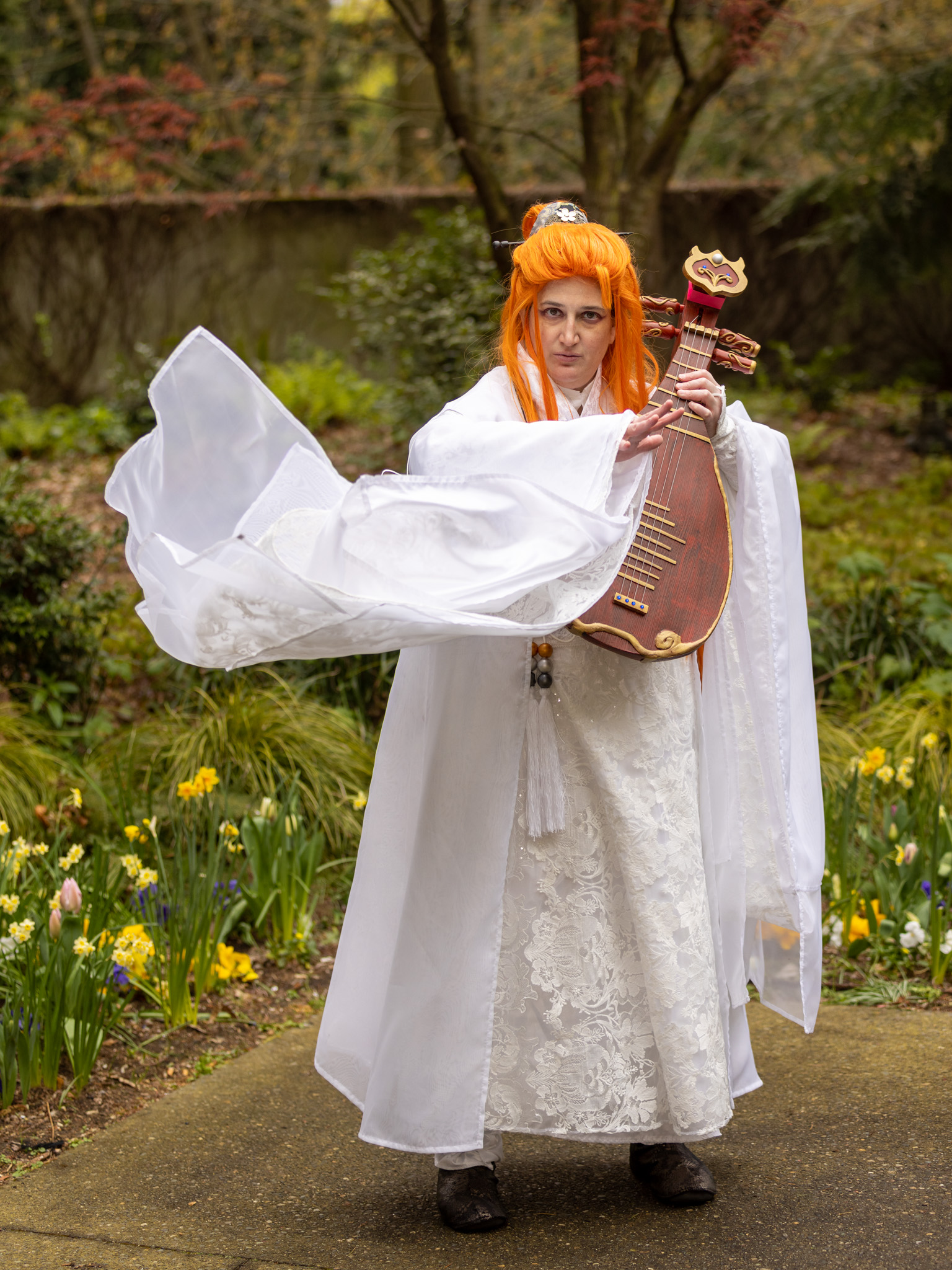 Lang with a swishy sleeve, flowing off to the left