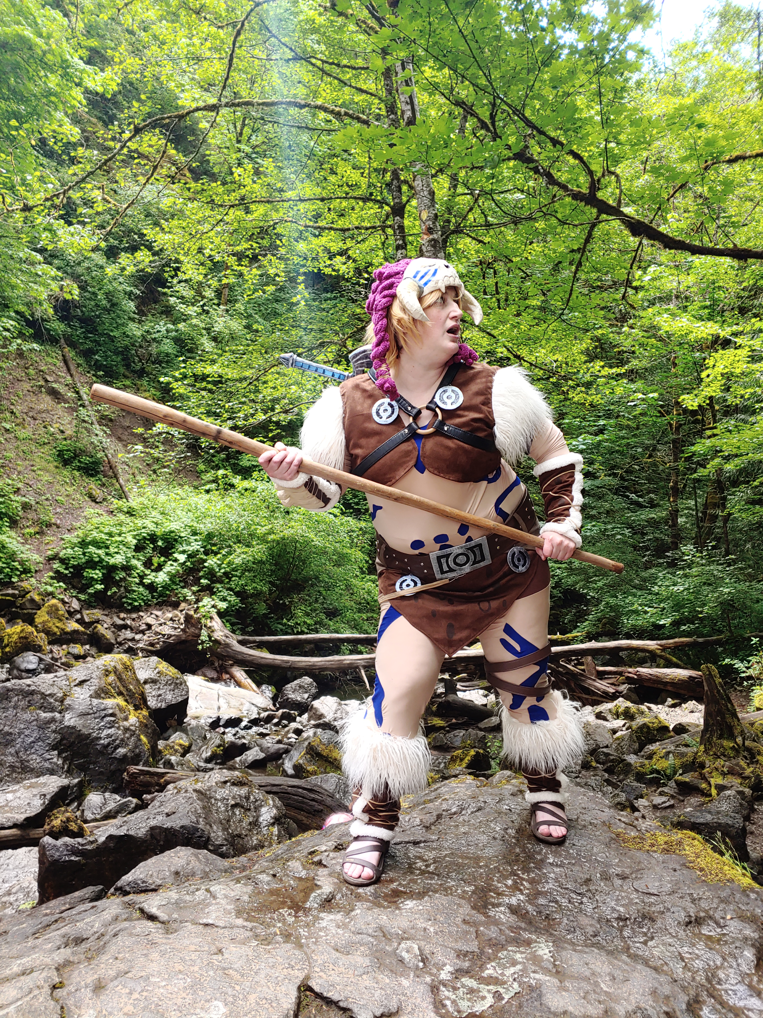 Link with a stick looking over right shoulder. "Oh no! Is that a Hinox?!"