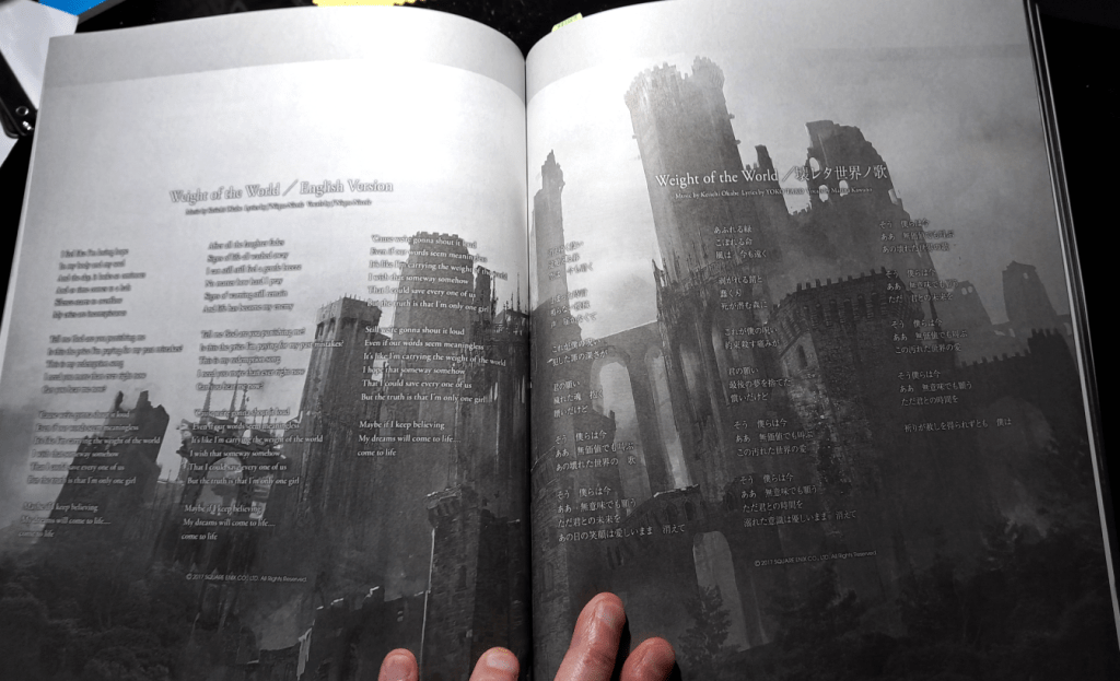 Lyrics in English (left page) and in Japanese (right page) with the Forest Castle in the background