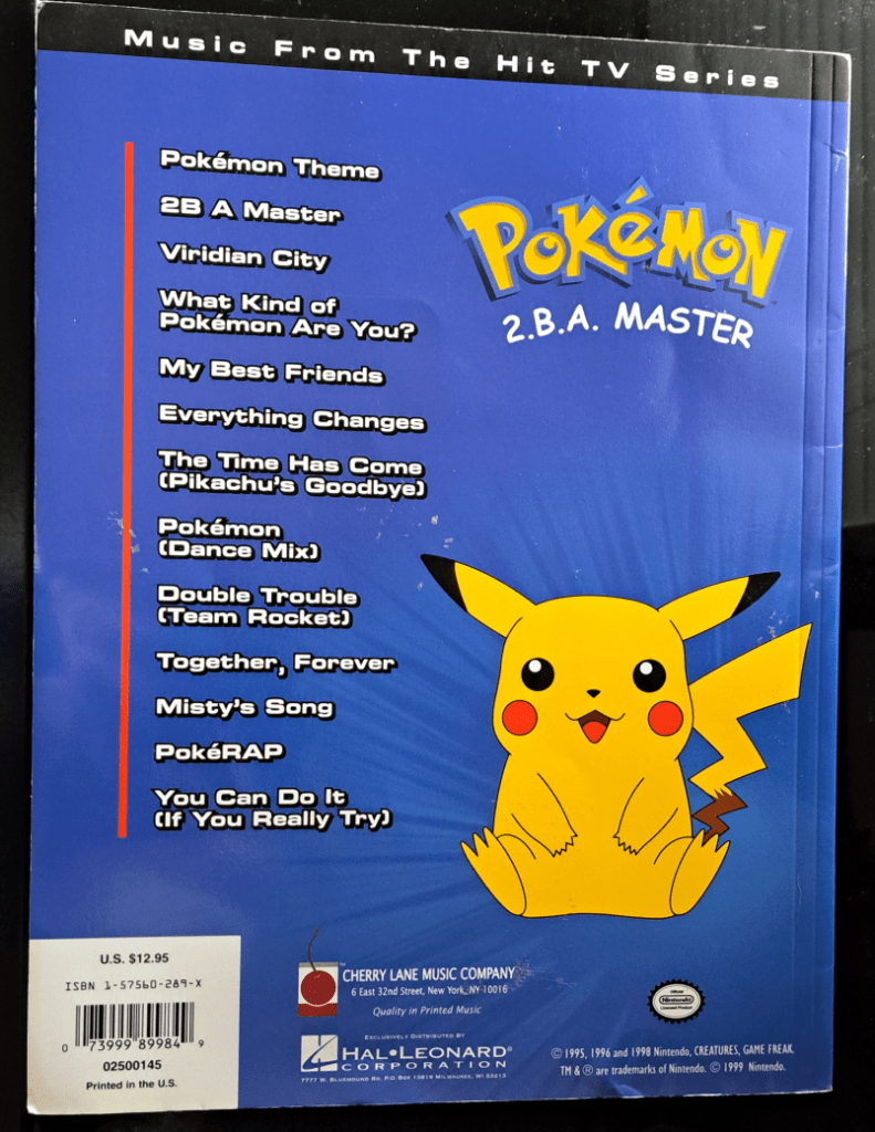 Blue back cover with a black banner at the top that says "Music from the Hit TV Series". On the right is the "Pokemon 2.B.A. Master logo" with Pikachu sitting below it. On the left is the list of songs in the book. Refer to Song List section above for full text.