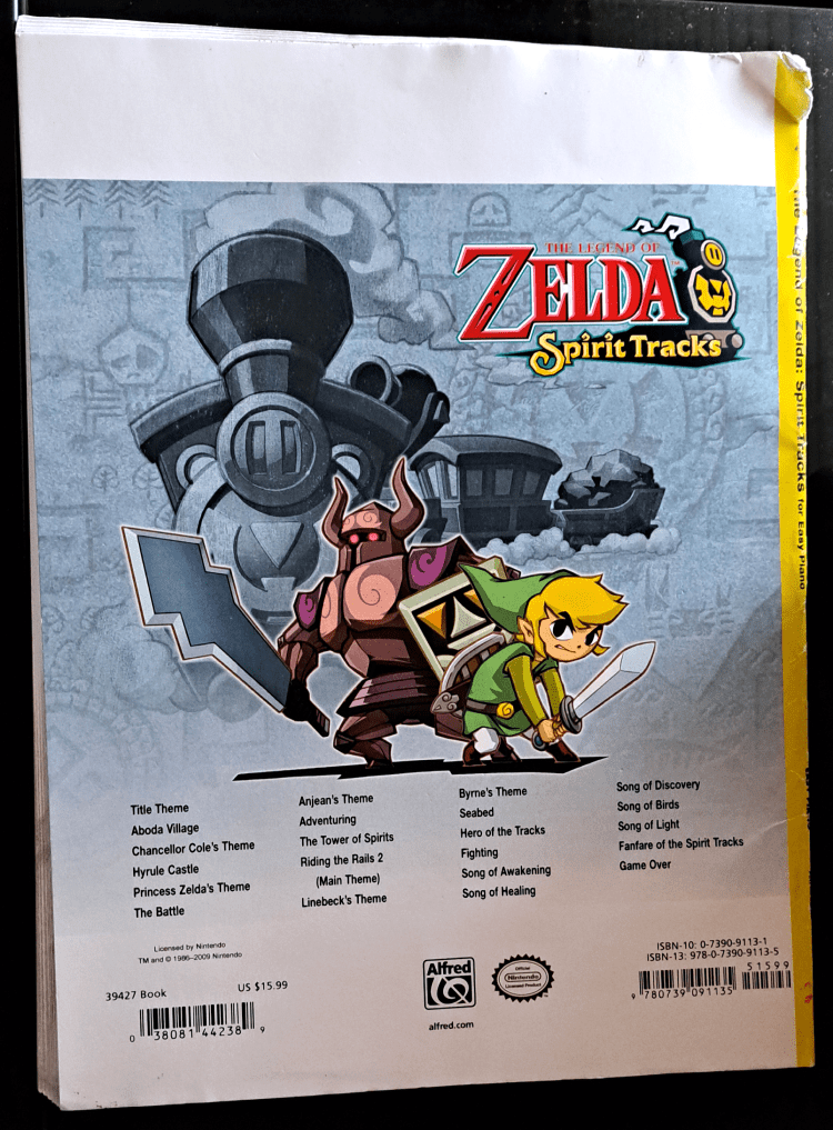 Back cover of the book. A yellow stripe on the left is part of the spine. The rest of the book is white with a runic map in the background in gray. Link stands with a Phantom, poised for battle, with the Spirit Train behind them. At the bottom is a list of songs. Refer to Song List section for text.