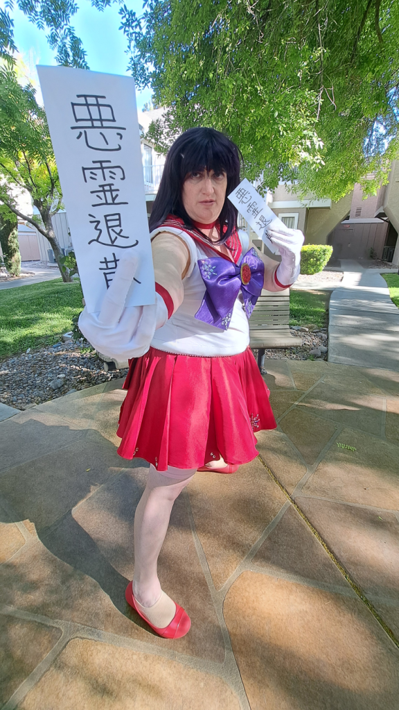 Mars with two ofuda, one forward and close to the camera