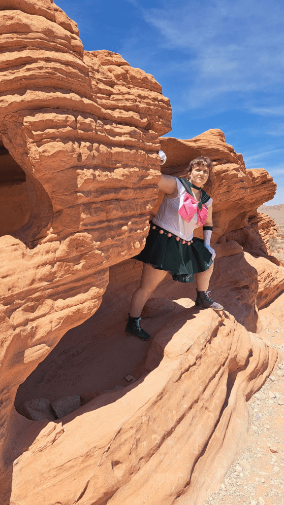 Jupiter peeking out of layered rocks