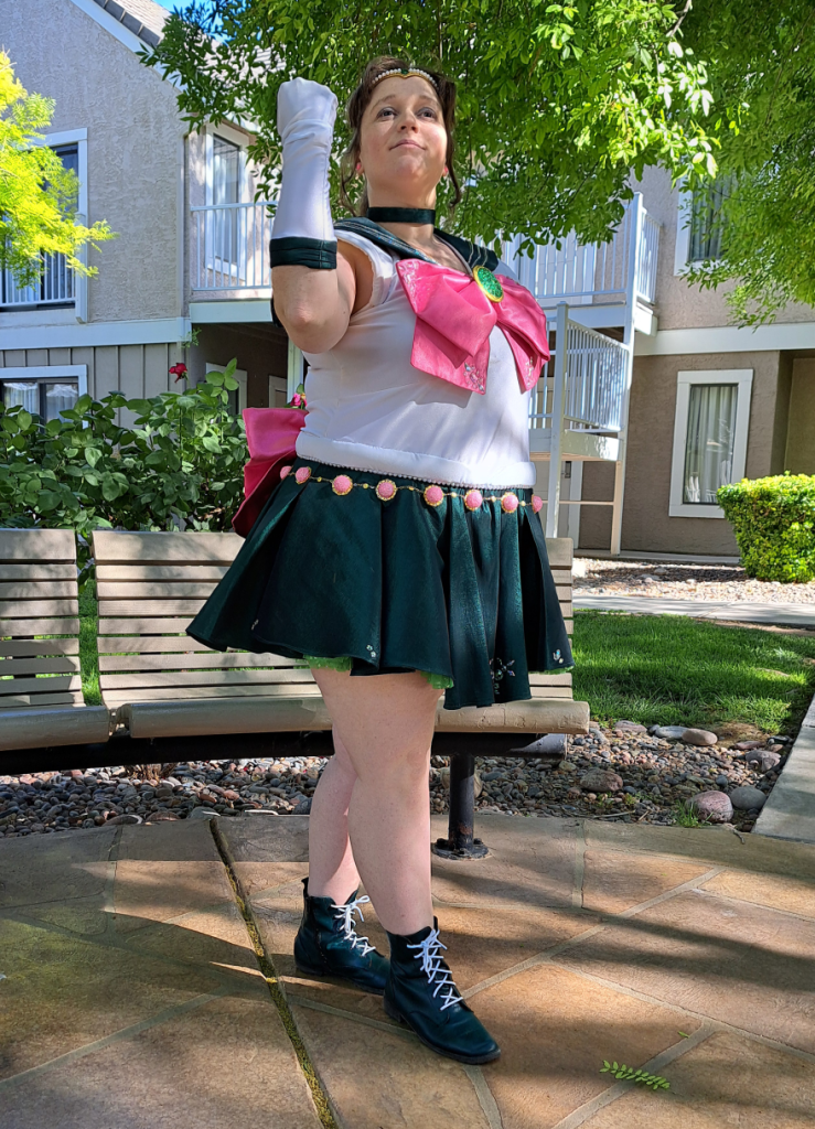 Jupiter with one arm halfway up, looking encouraging